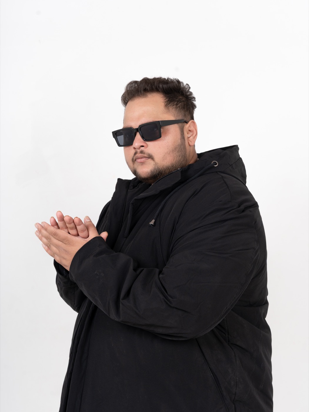 TEDD press photo — black jacket, studio