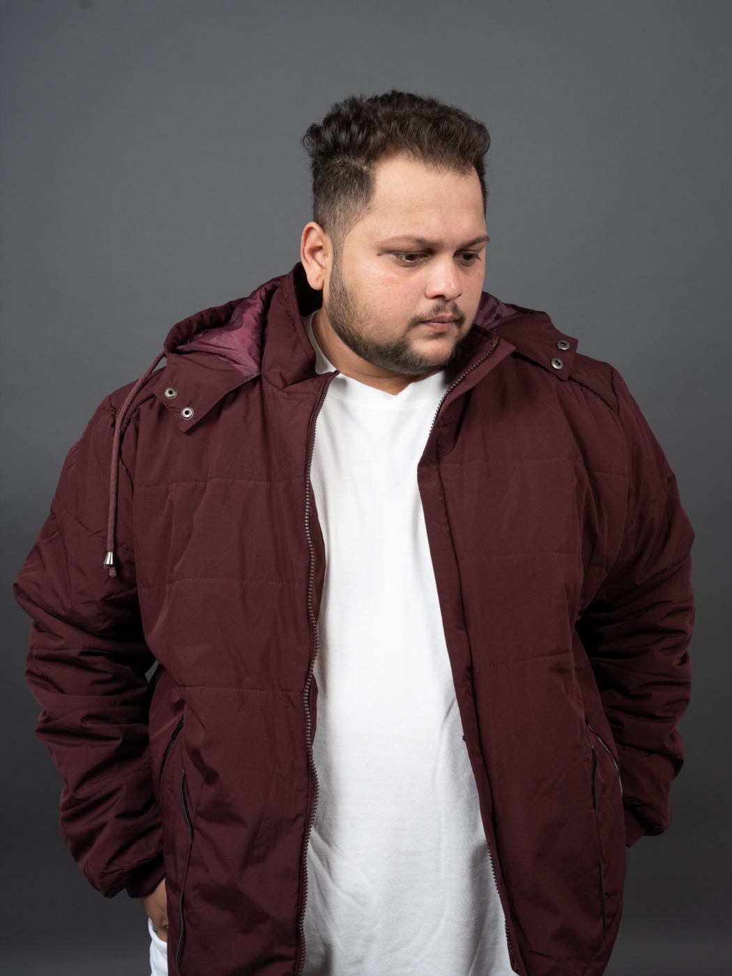 TEDD press photo — burgundy jacket, studio